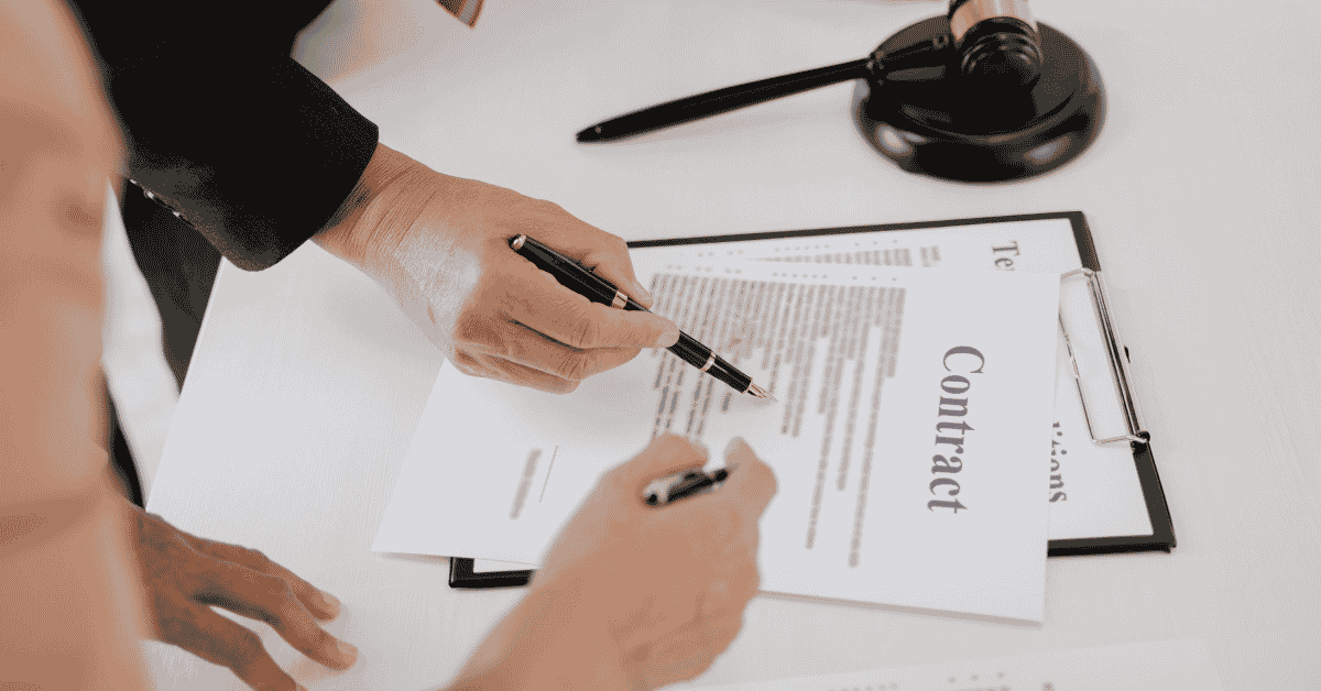 Signing contract papers with the attorney