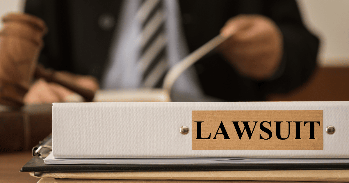 Attorney reading law books regarding a lawsuit